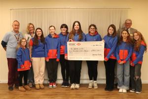 The Girl Guides who will be attending Olave with, on the left, President Mike Barker, Guide Leader Wendy Fortune and Paul Vaesen Chair of Youth Services Committee.